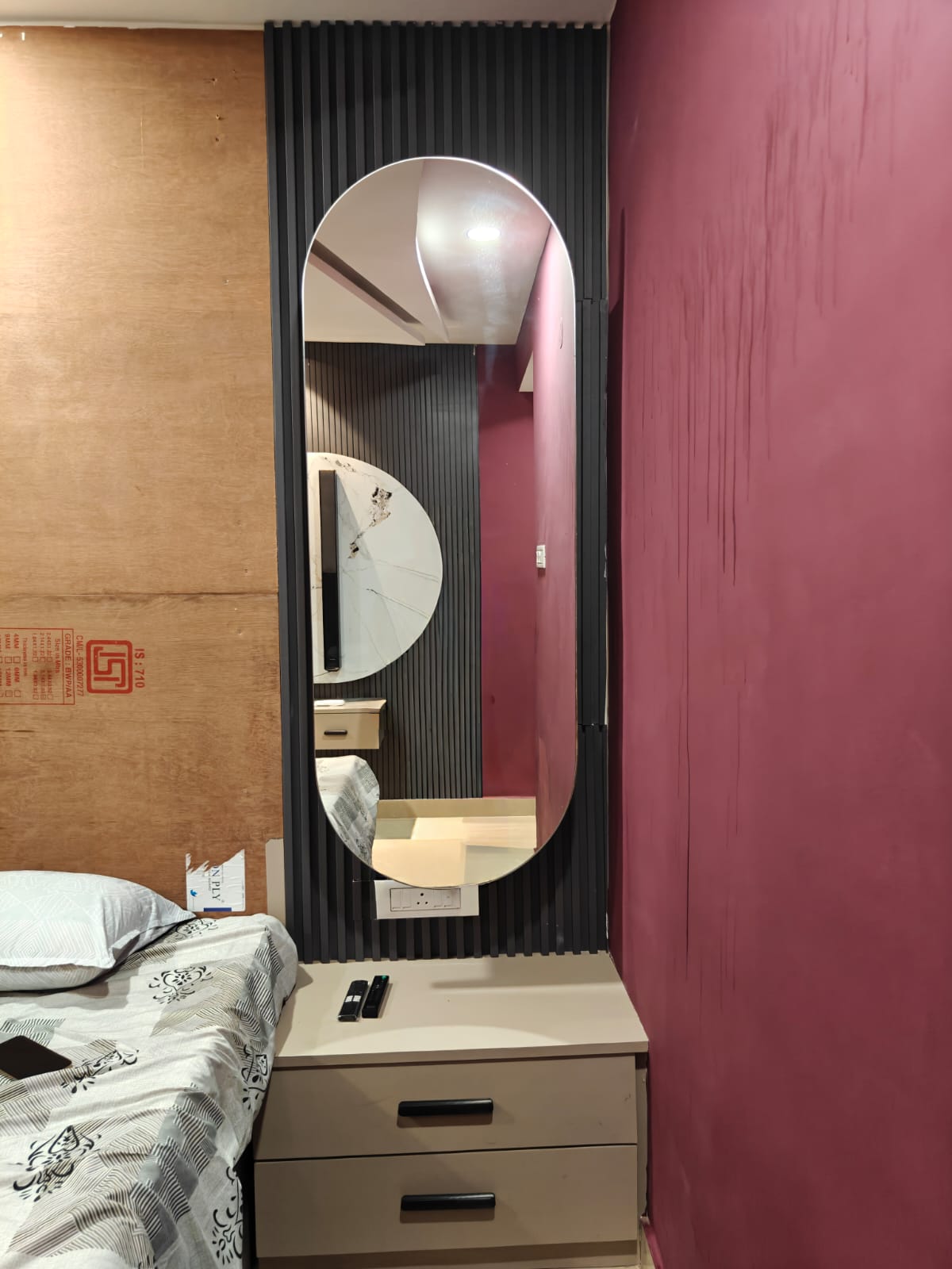 Bedroom dressing unit with mirror and wall panel