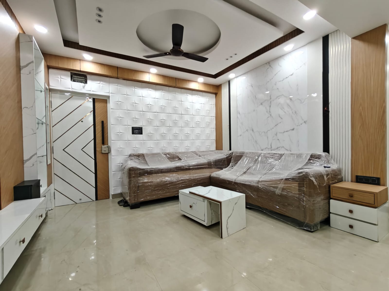 Complete living room interior with sofa, wall panel and center table